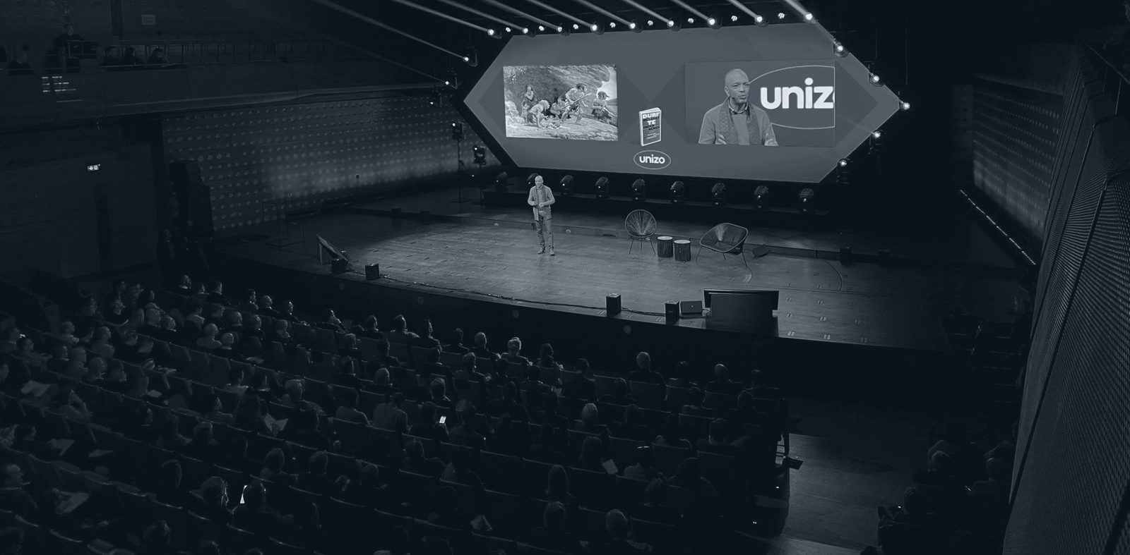 Rachid Et-Taïbi delivering a keynote to a full auditorium